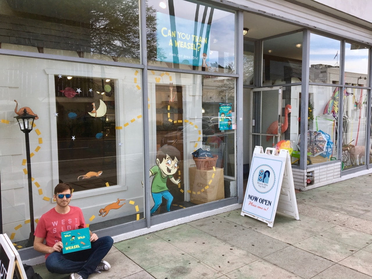 Here's Wild Wild Weasel illustrator Dave Leonard with our new book in front of the toy store!